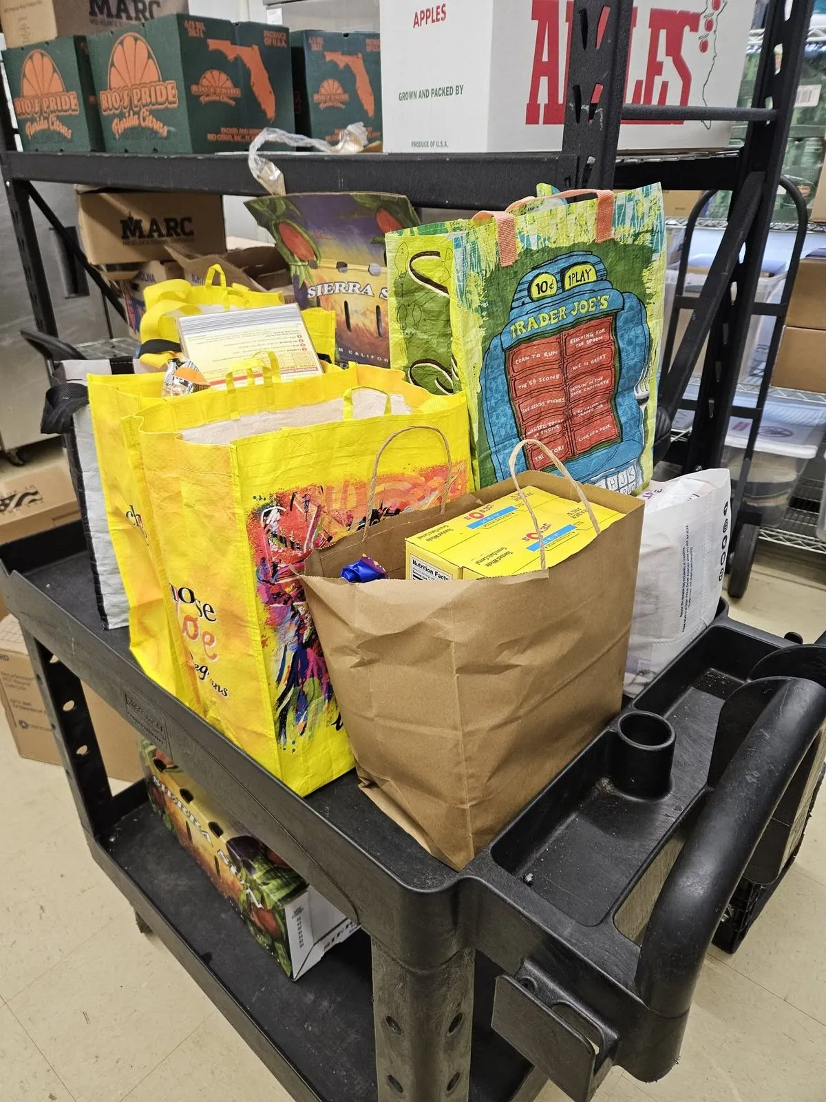 A cart piled with donated groceries.