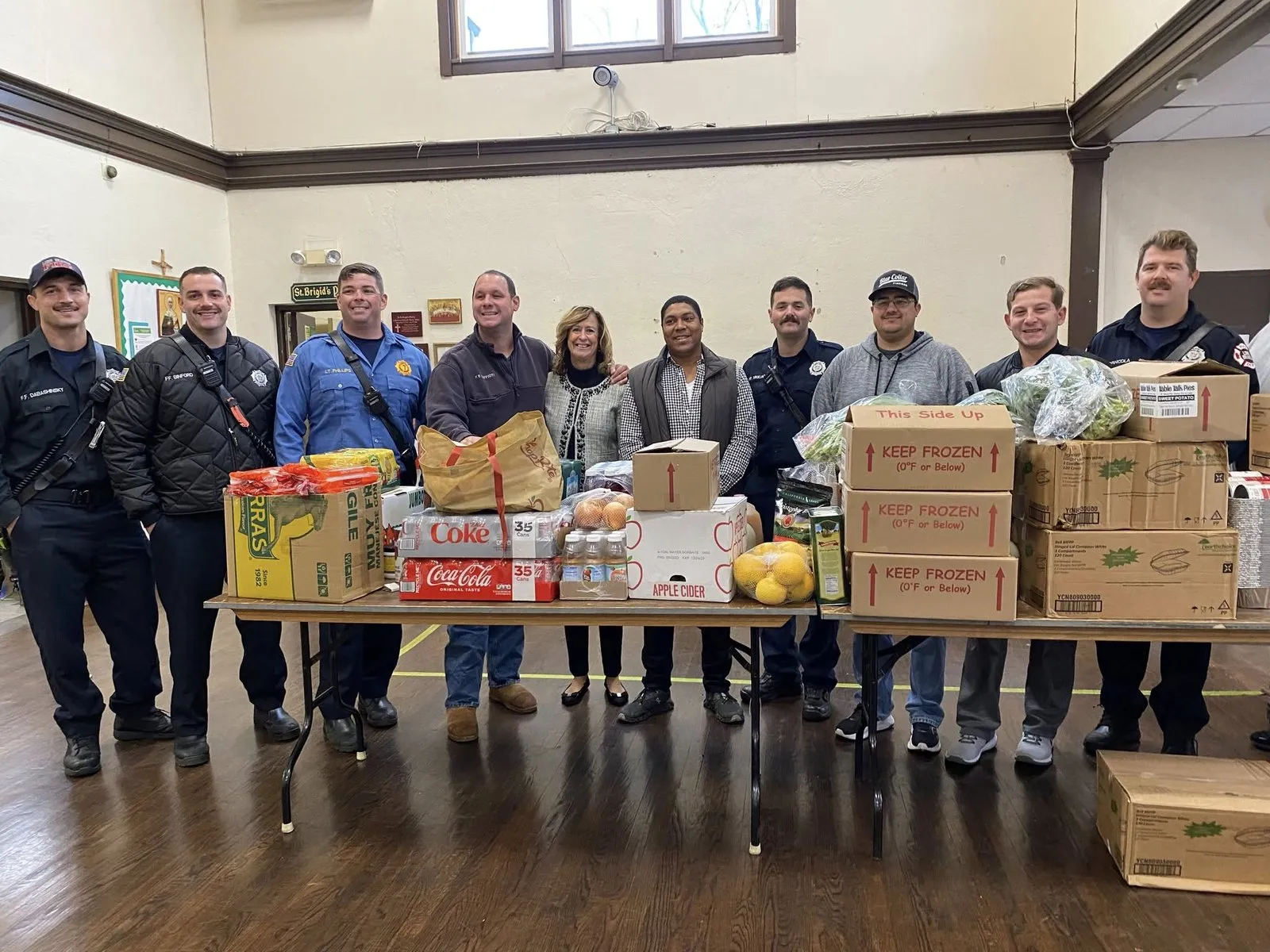 Long Branch firefighters serving at the pantry.