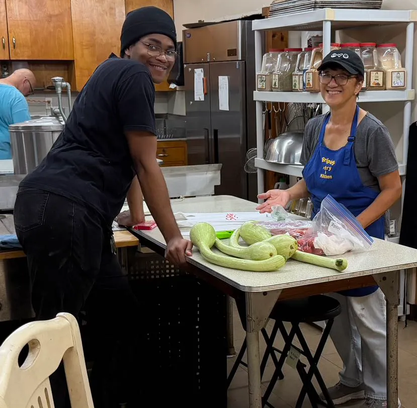 A smiling St. Brigid's kitchen volunteer.