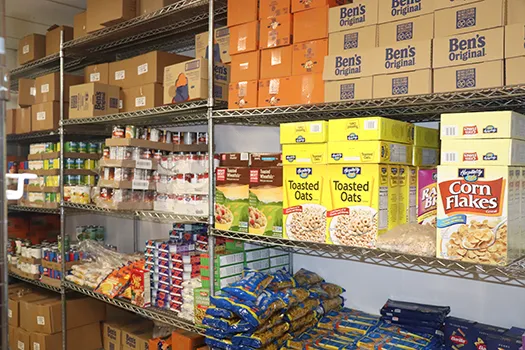Shelves in the St. Brigid's pantry stocked with cereal, canned goods and staples.
